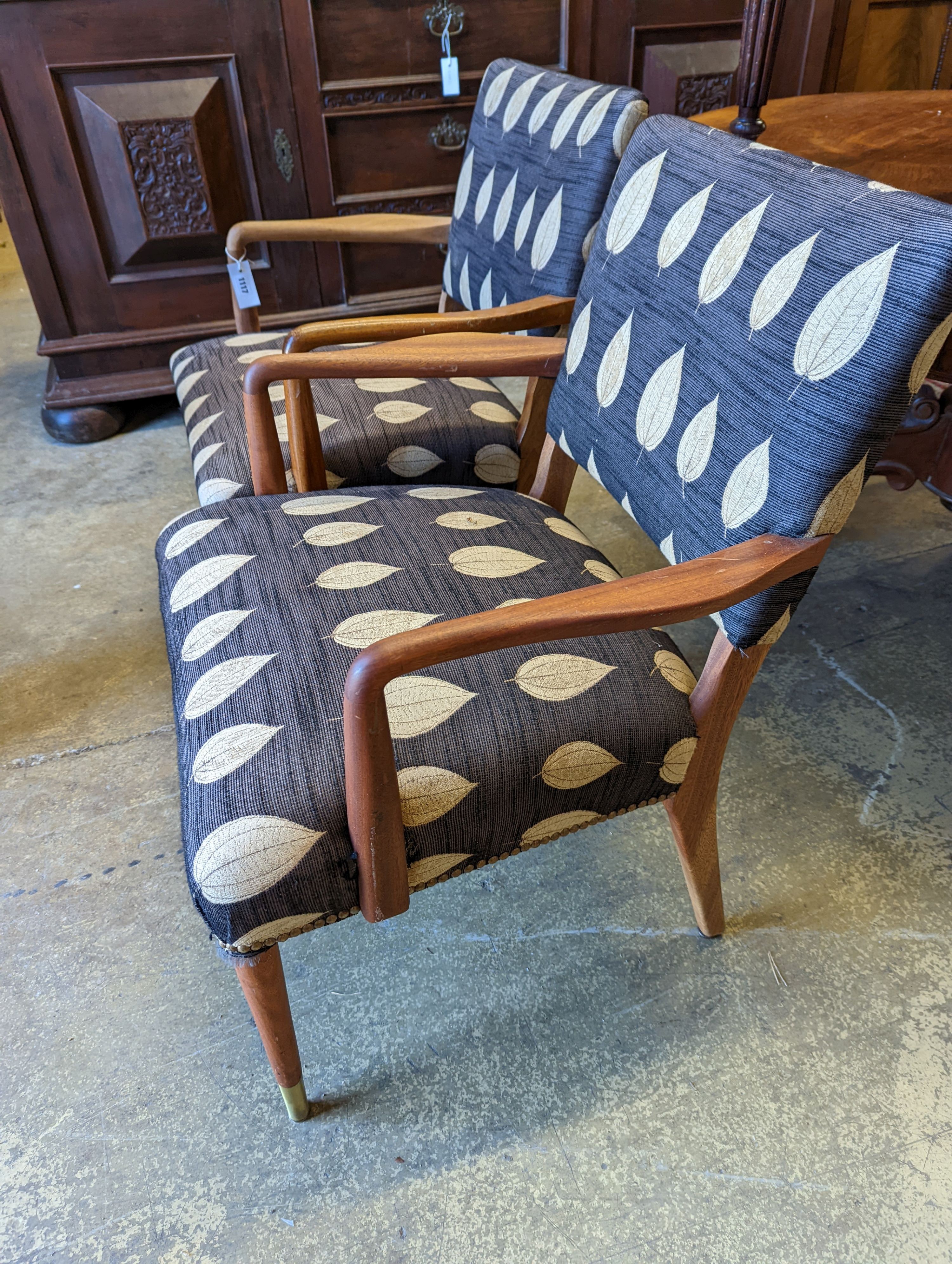 A pair of mid century Danish design teak elbow chairs, width 60cm, depth 54cm, height 83cm